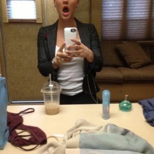 celeb kaley cuoco opens her mouth widely and takes a pic