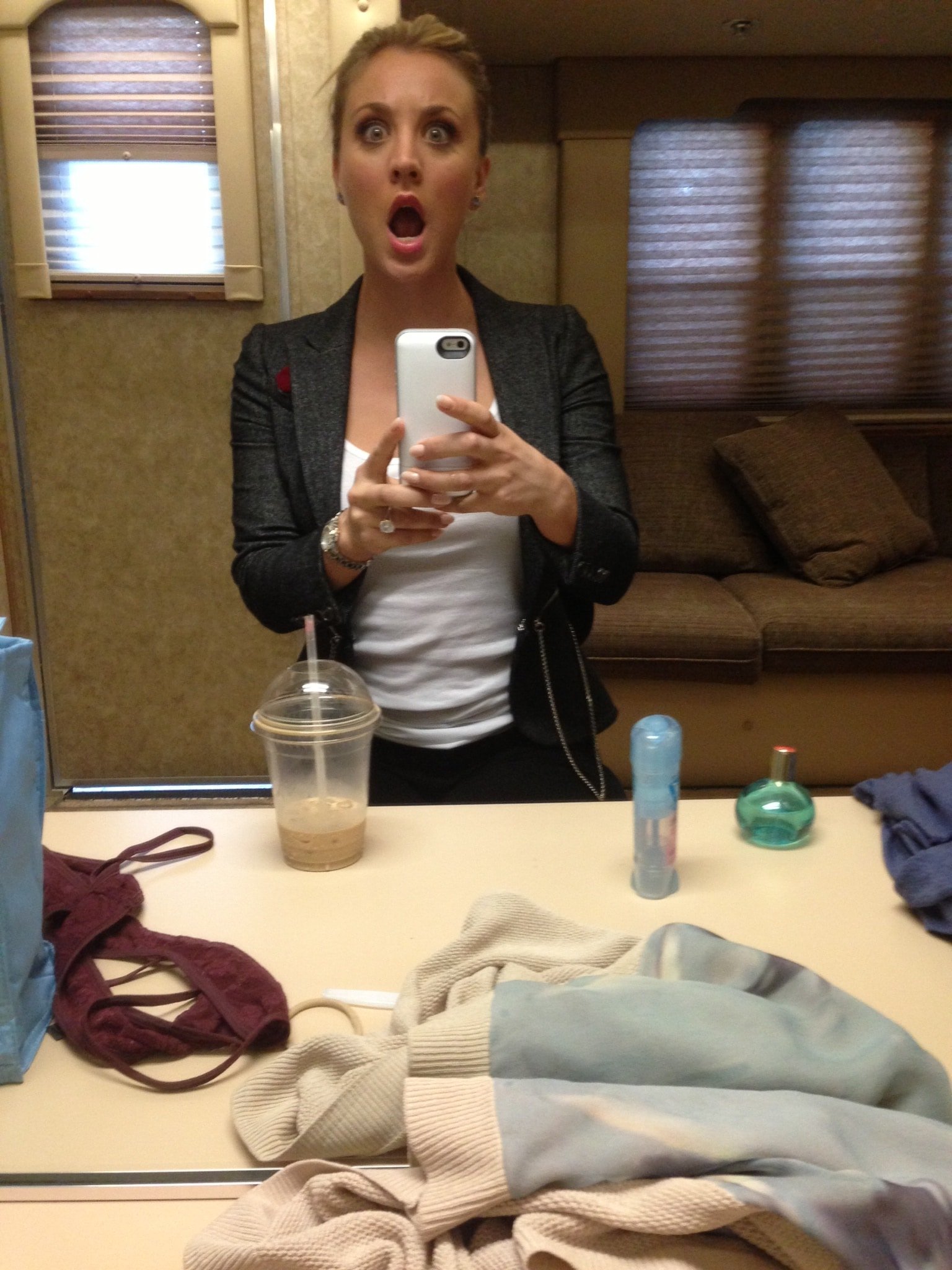 celeb kaley cuoco opens her mouth widely and takes a pic